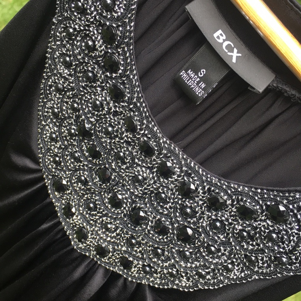Beaded black sleeveless top for women.